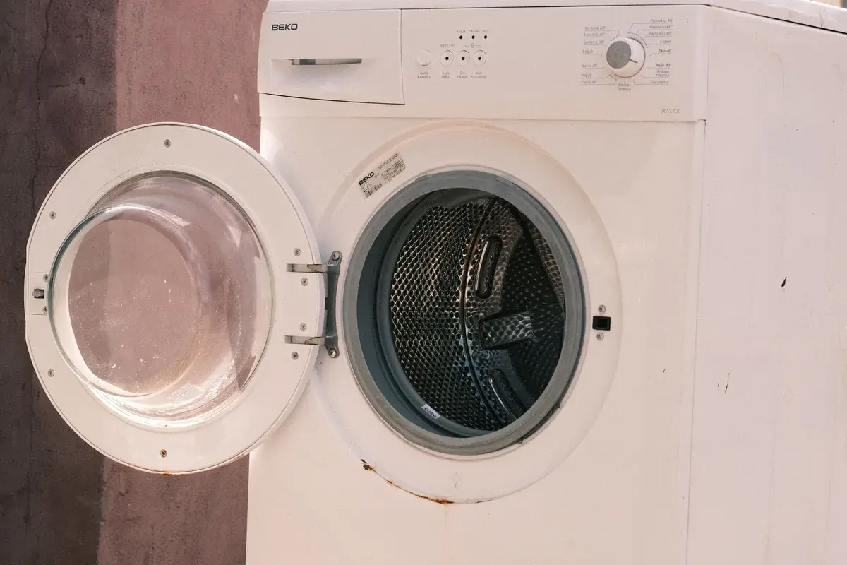 a single old dryer set out for pickup