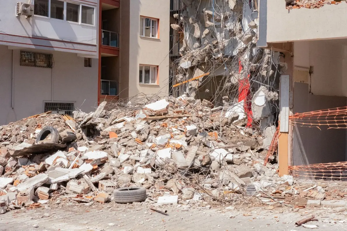 a pile of demolition rubble and drywall
