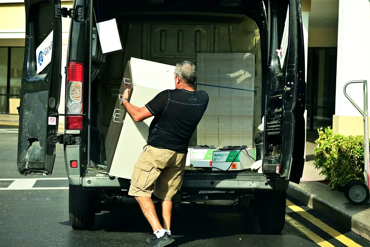 a loaded junk removal truck heading to unload